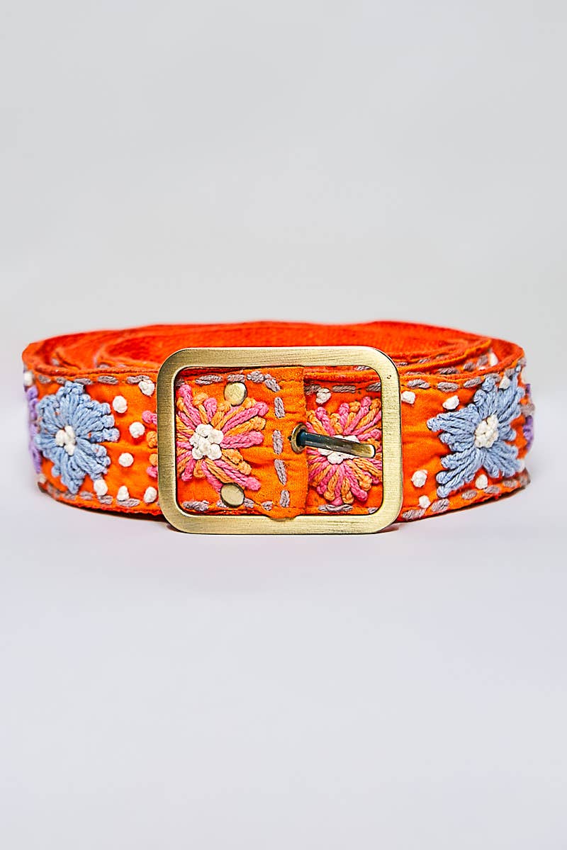 Orange belt with floral embroidery and a gold buckle on a light gray background