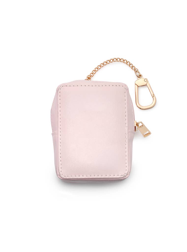 A small light pink zippered pouch with a gold-tone chain strap and carabiner clip, shown on a clean white background.