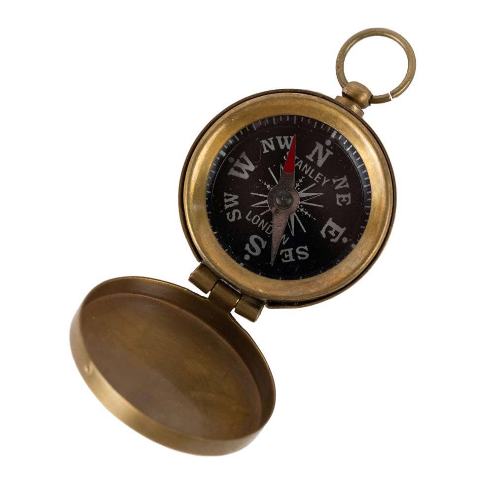 Brass pocket compass on a white background