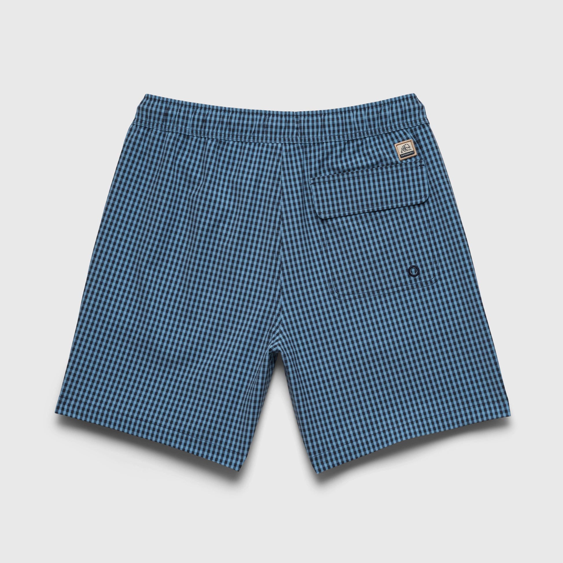 Blue checkered shorts on a light gray background