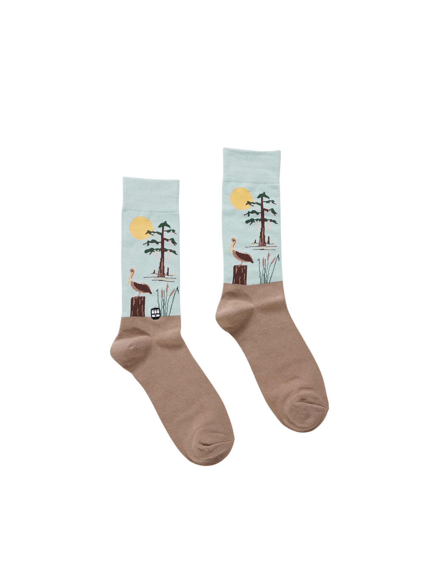Pair of socks with a nature-themed design on a white background