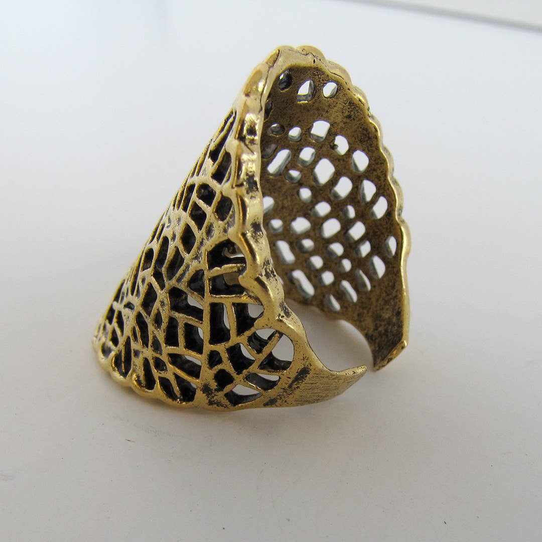 Gold lace ring on a white background