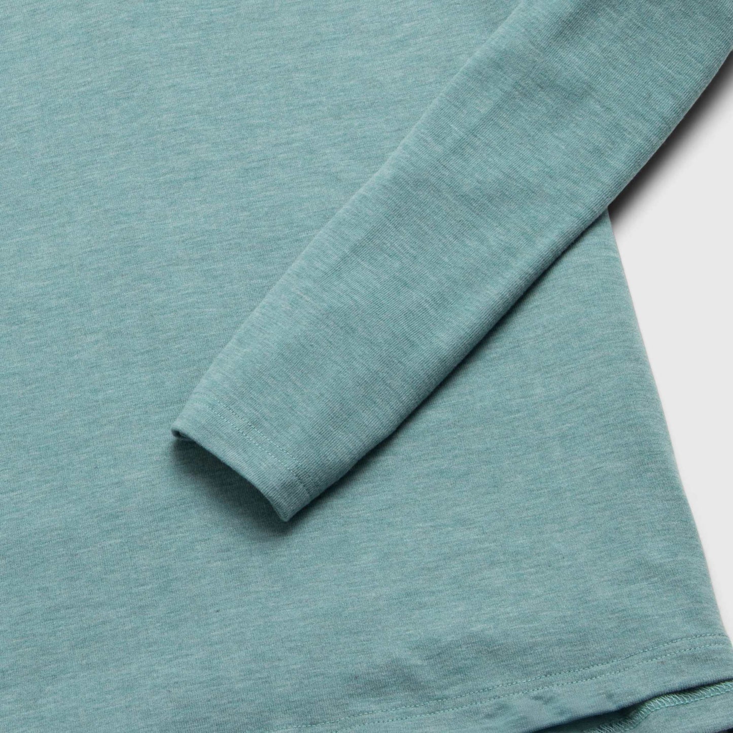 Teal long-sleeve shirt on a white background
