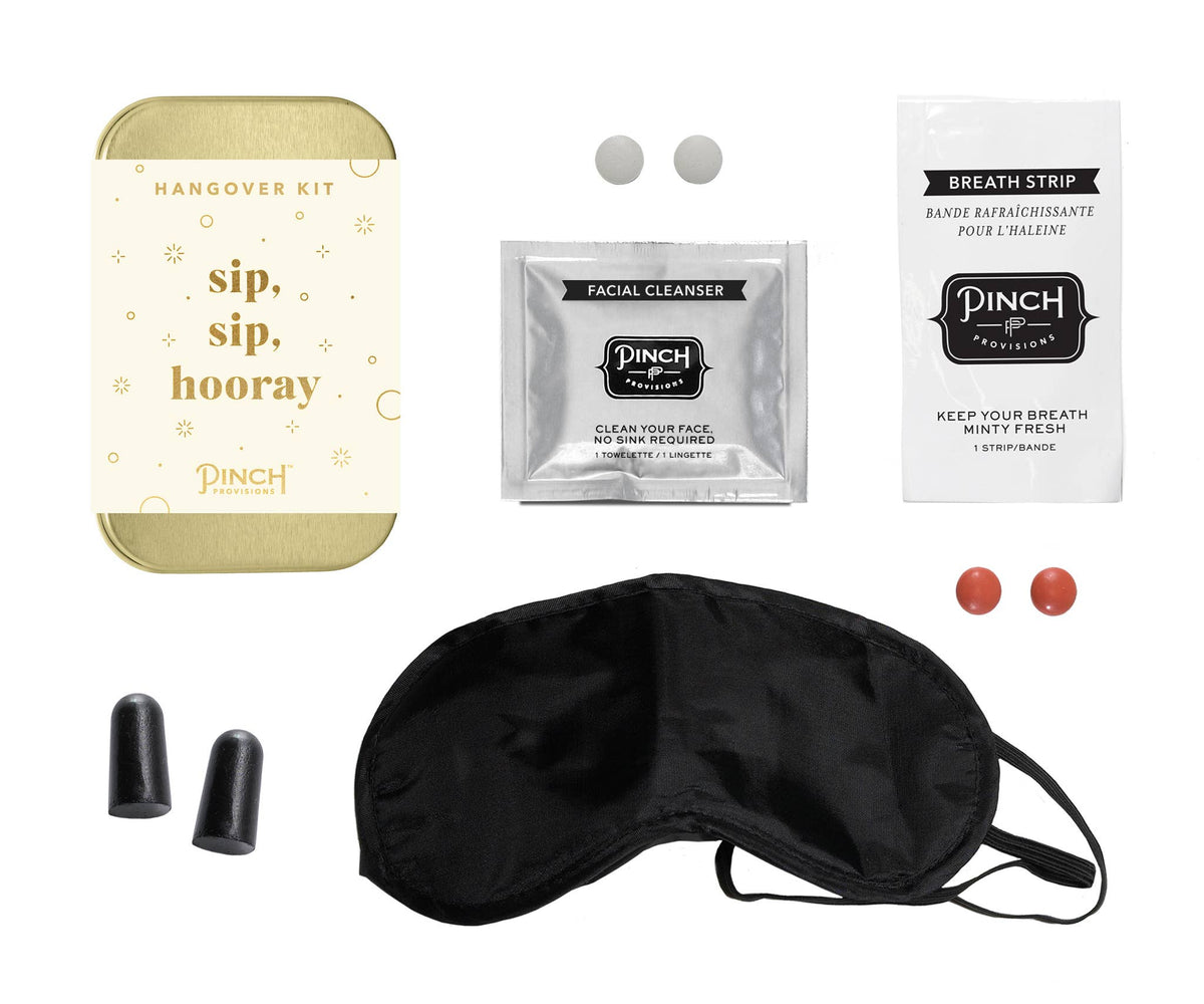 Collection of items including a sleep mask, facial cleanser, breath strip, and earplugs on a white background.