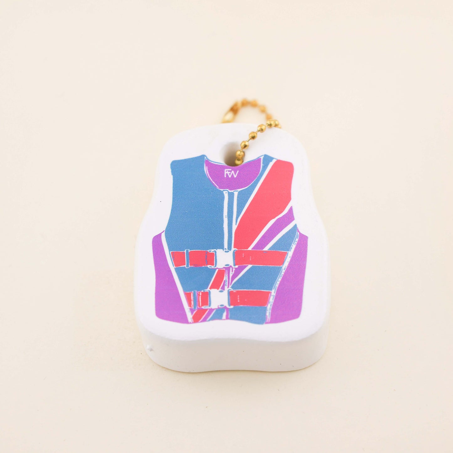 Keychain with a colorful life jacket design on a beige background