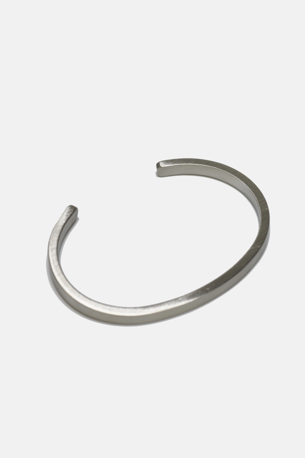 Silver bangle on a white background
