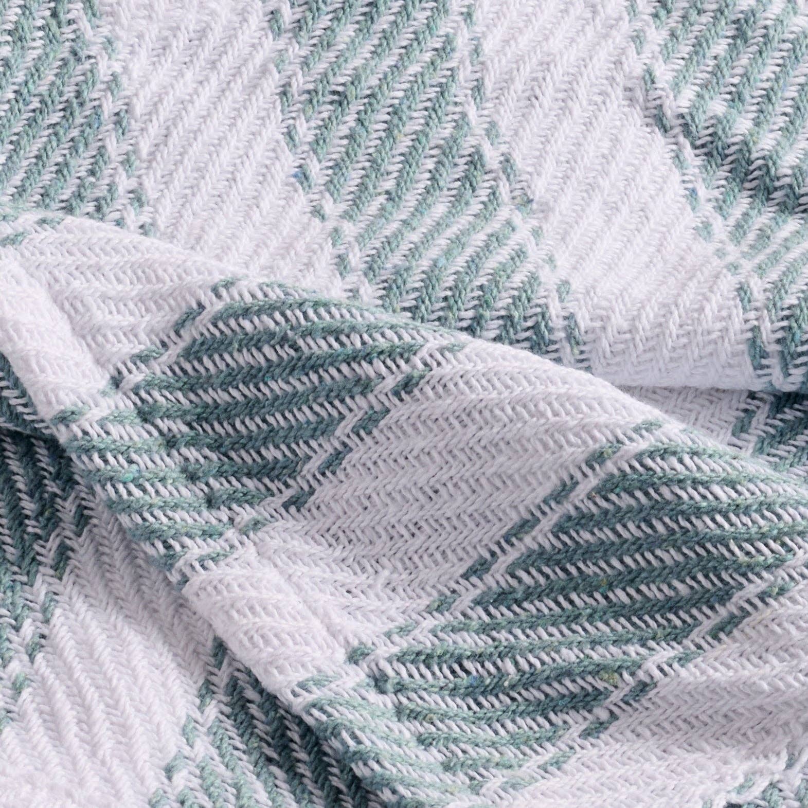 Close-up of textured fabric with green and white pattern