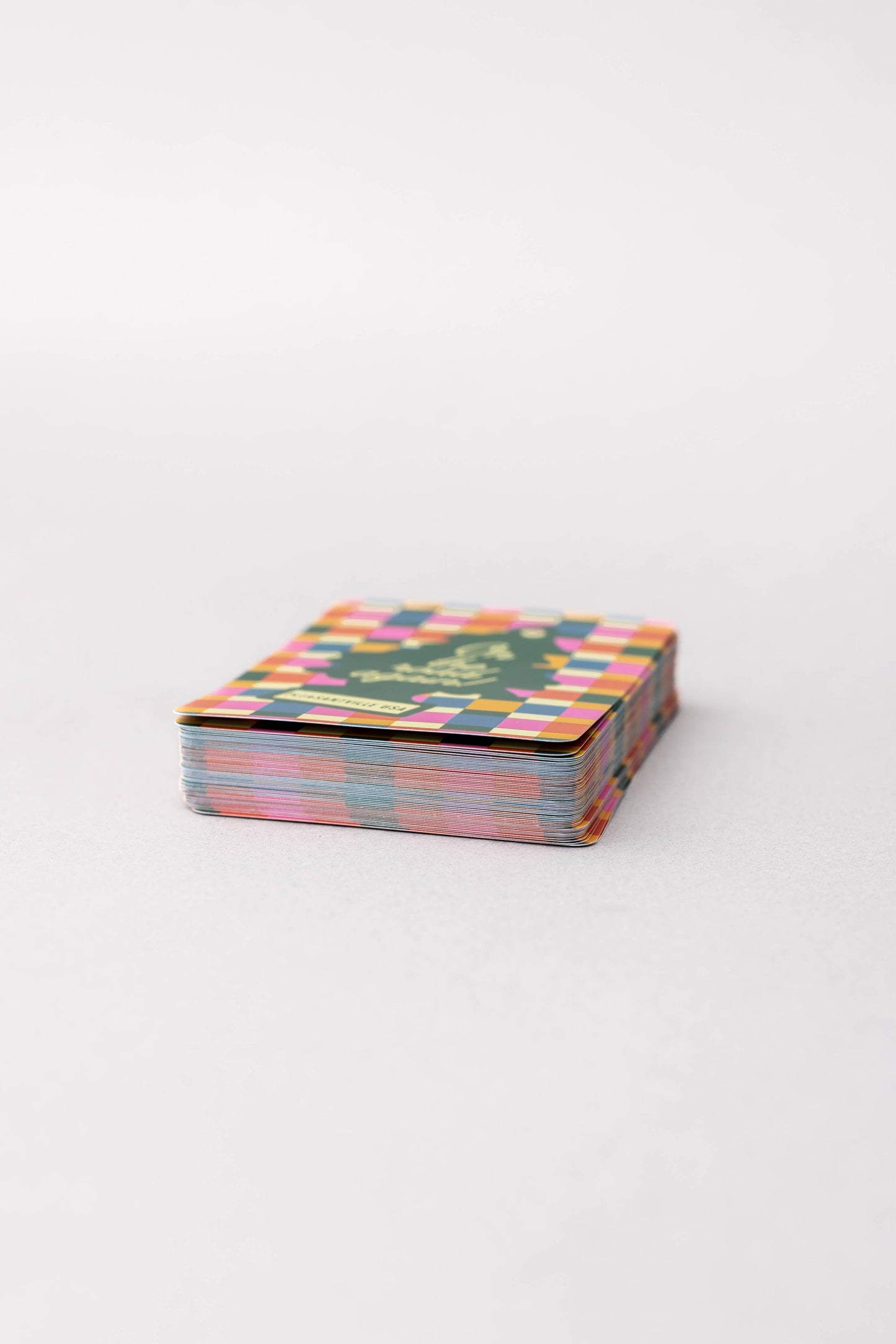Stack of colorful greeting cards on a white background