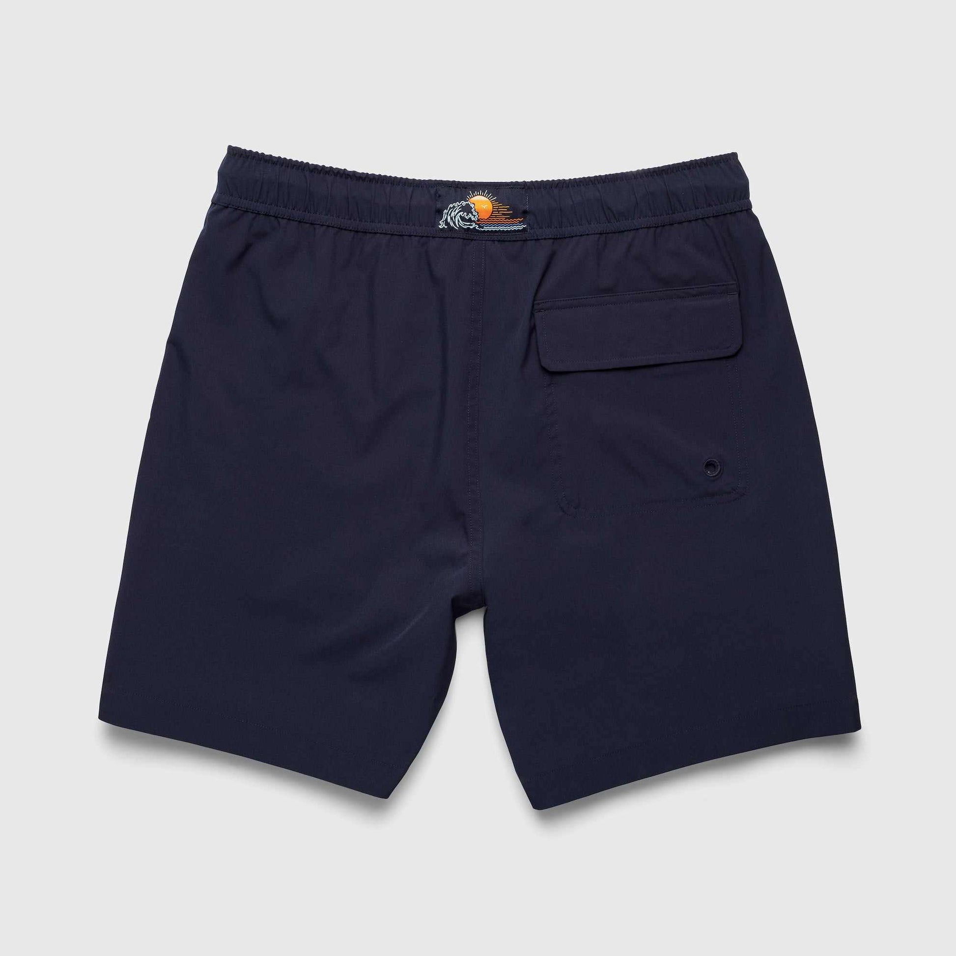 Navy blue shorts with a brand logo on a light gray background