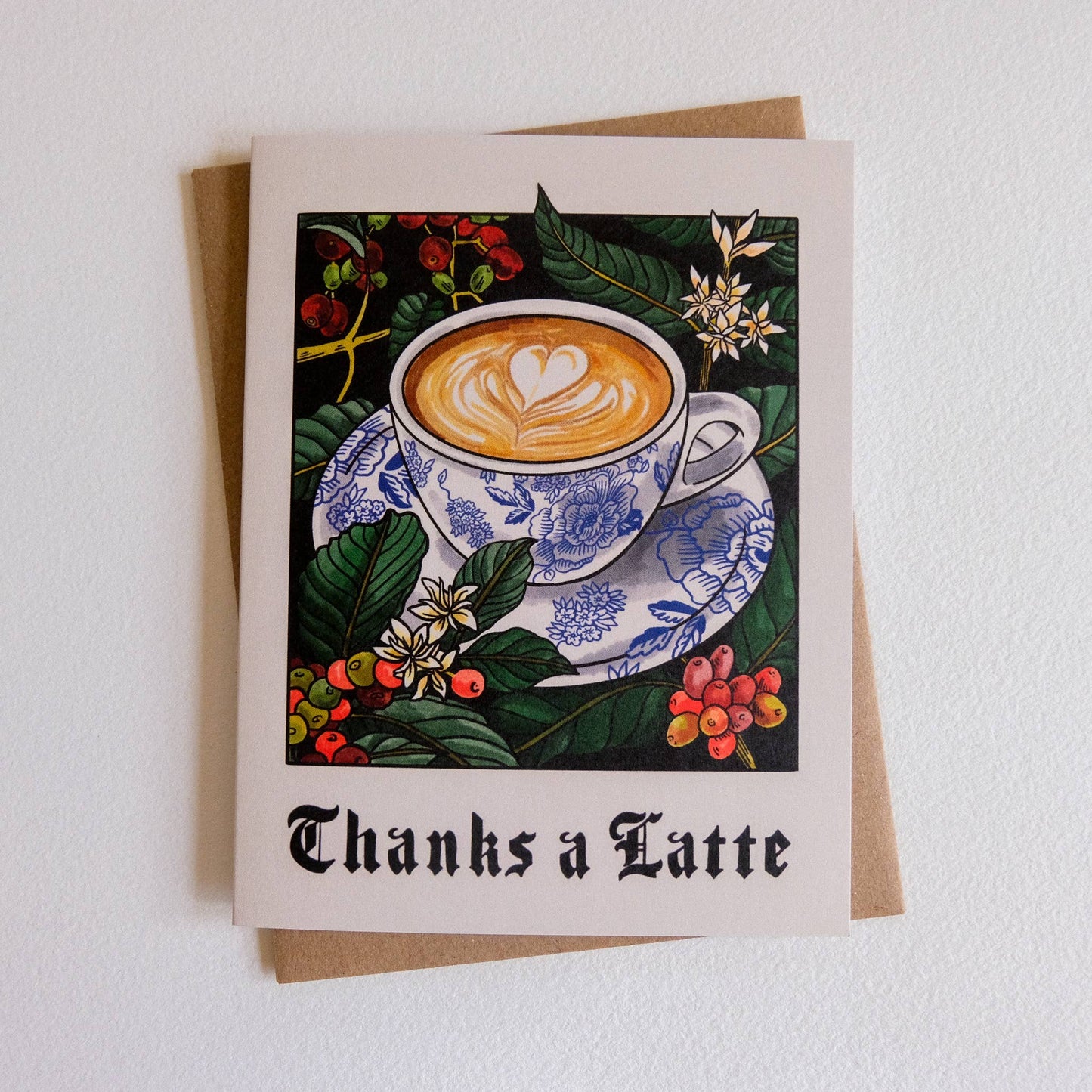 Greeting card with a coffee cup illustration and 'Thanks a Latte' text on a white background