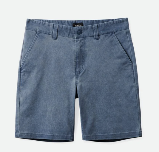 A pair of navy vintage wash chino shorts with belt loops and a zipper fly.