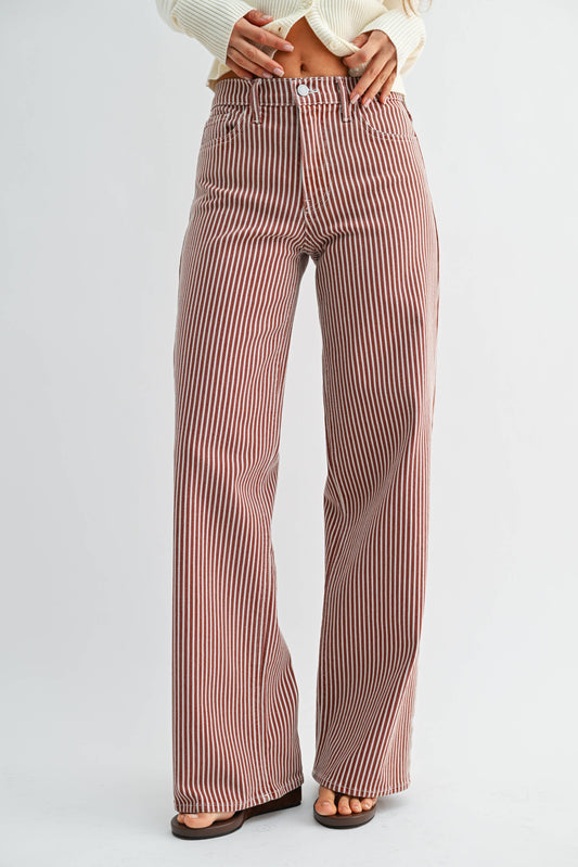 Striped pants worn by a person on a white background