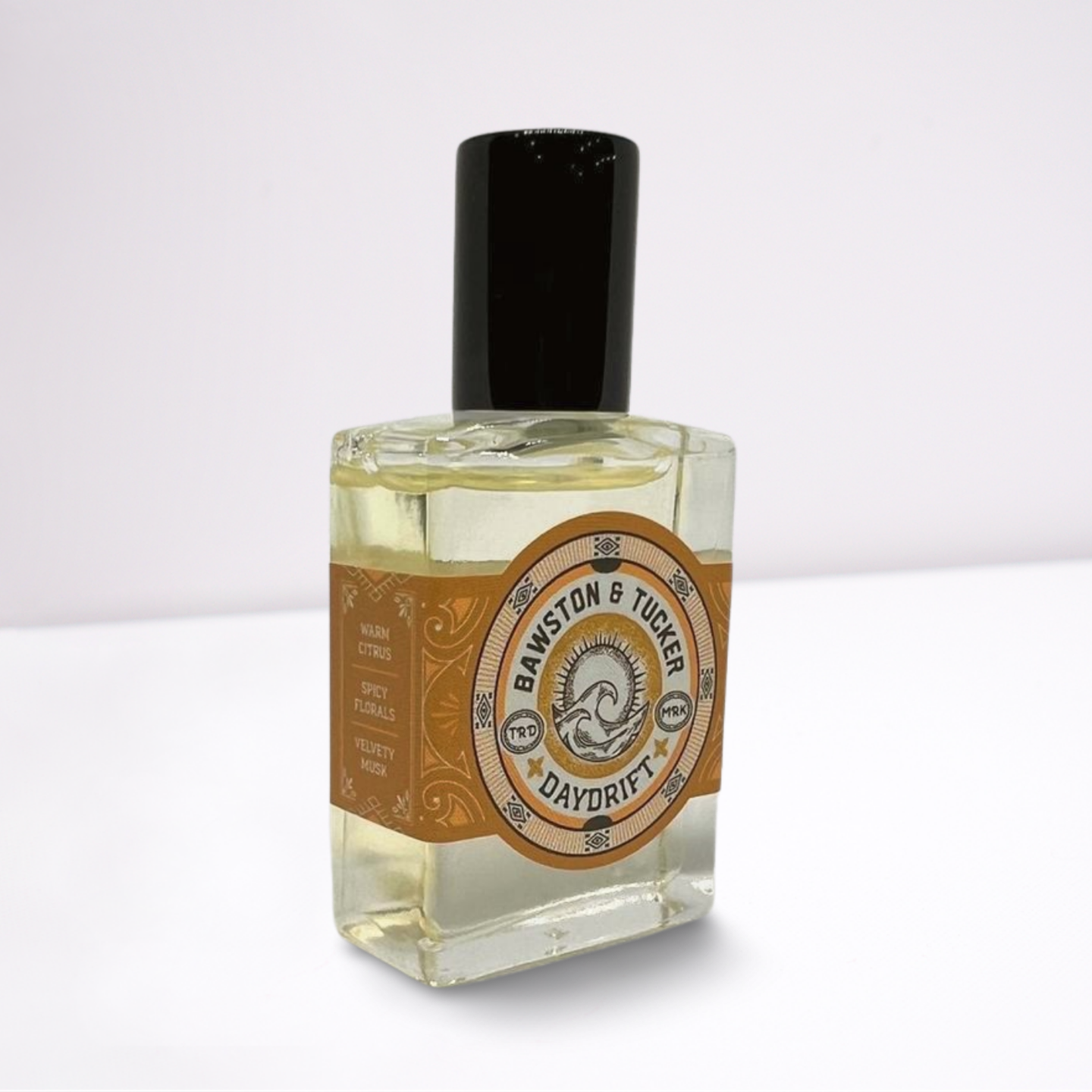 Perfume bottle with decorative label on a white background