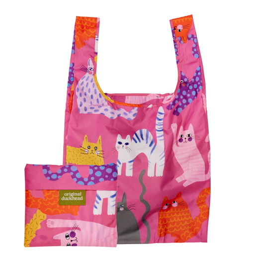 Pink reusable bag with cat illustrations on a white background
