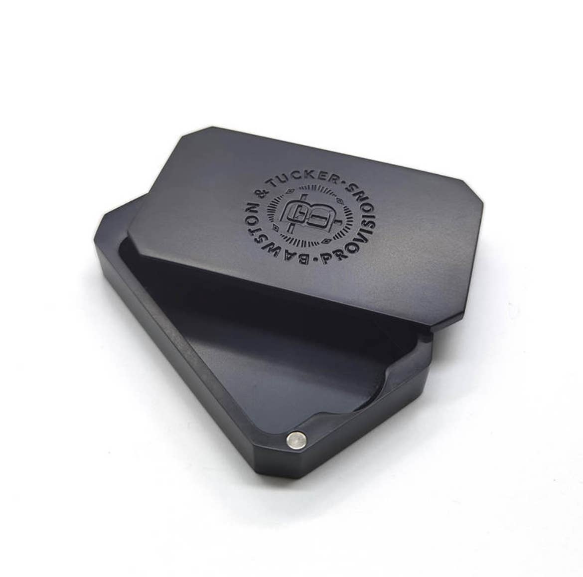 Black metal shoe shine block with branding on a white background
