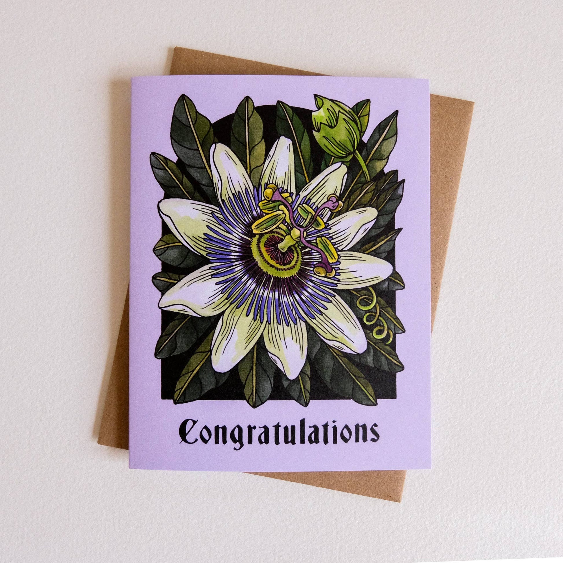 Greeting card with a floral design and 'Congratulations' text on a light background
