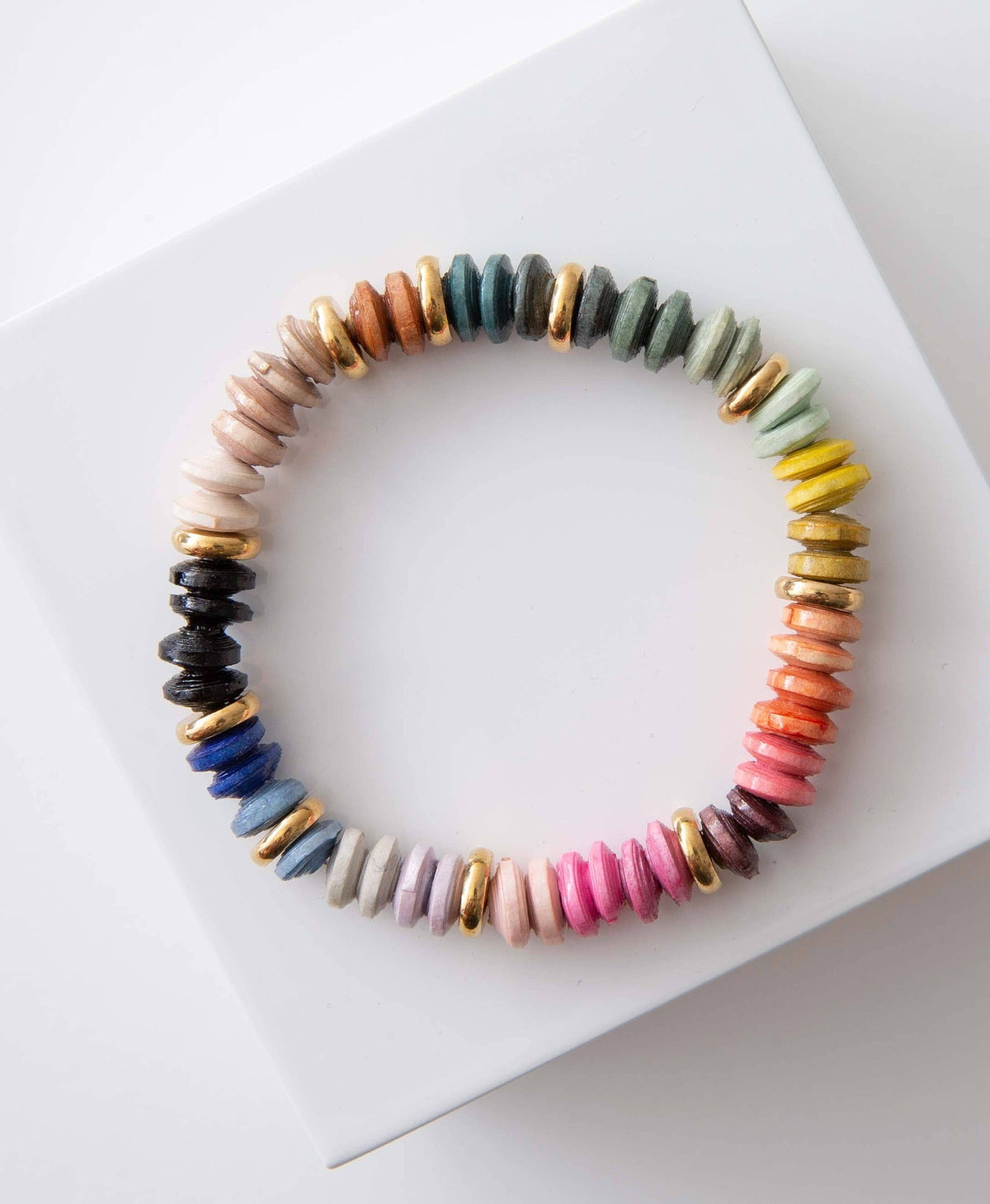 Multicolored beaded bracelet on a white surface