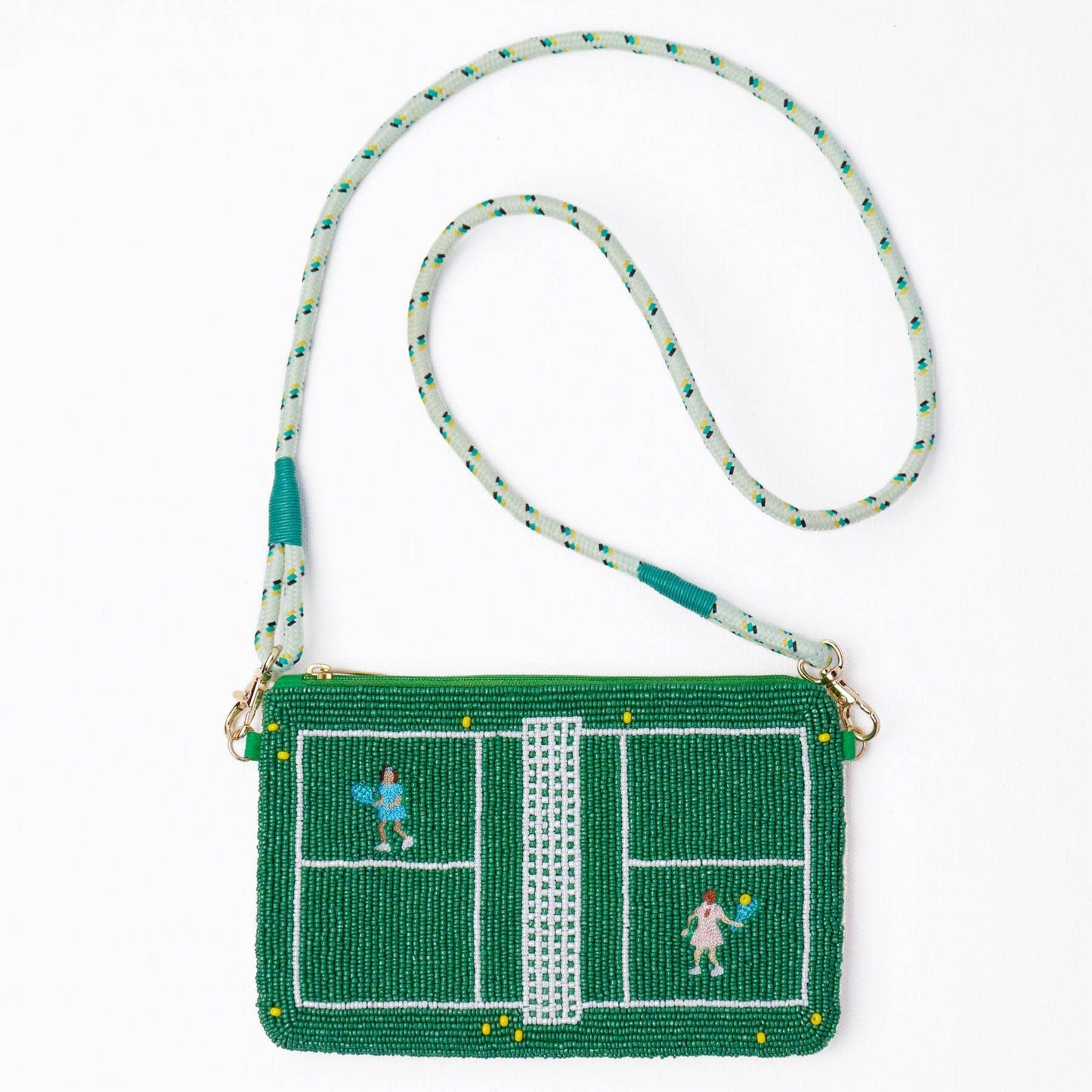 Crossbody bag with tennis court design and players on a white background
