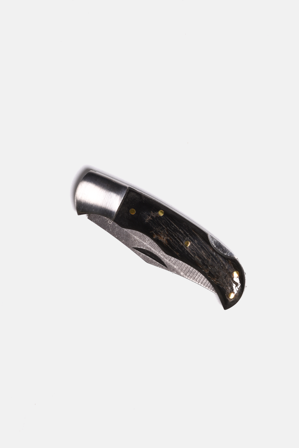 Folding knife with wooden handle on a white background