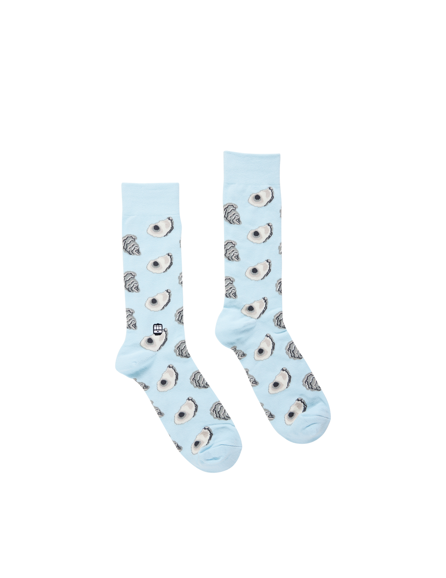 Pair of light blue socks with owl pattern on a white background
