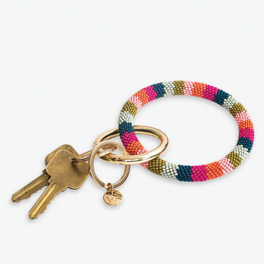 Colorful beaded keychain with keys on a white background