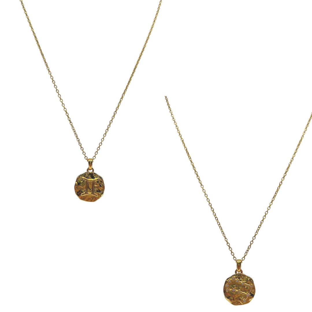 Two gold necklaces with circular pendants on a white background