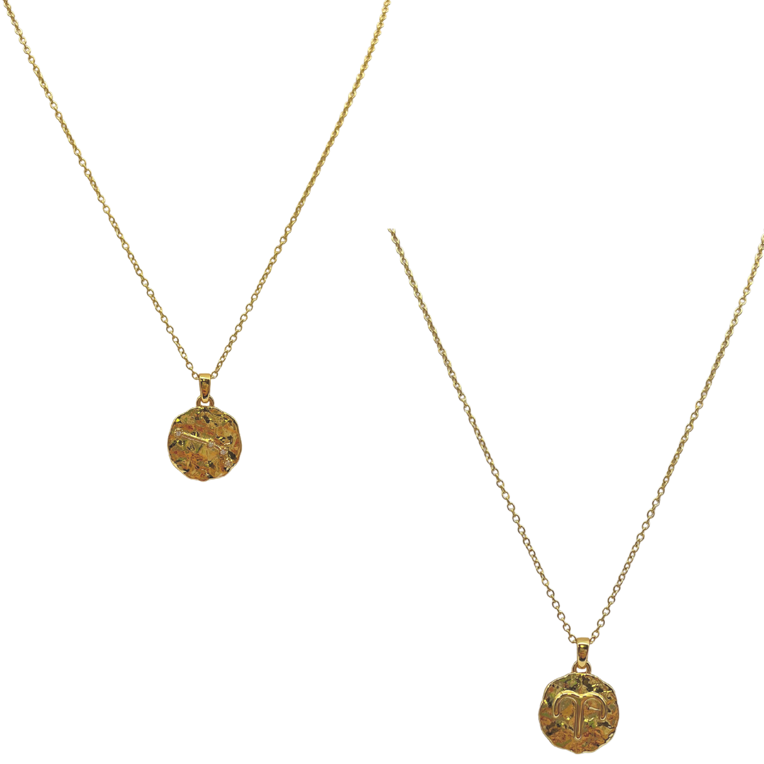 Two gold necklaces with circular pendants on a white background