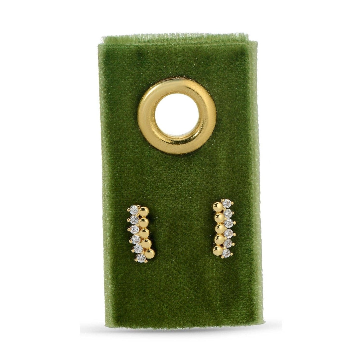 Gold and diamond earrings on a green velvet stand with a gold circular holder.