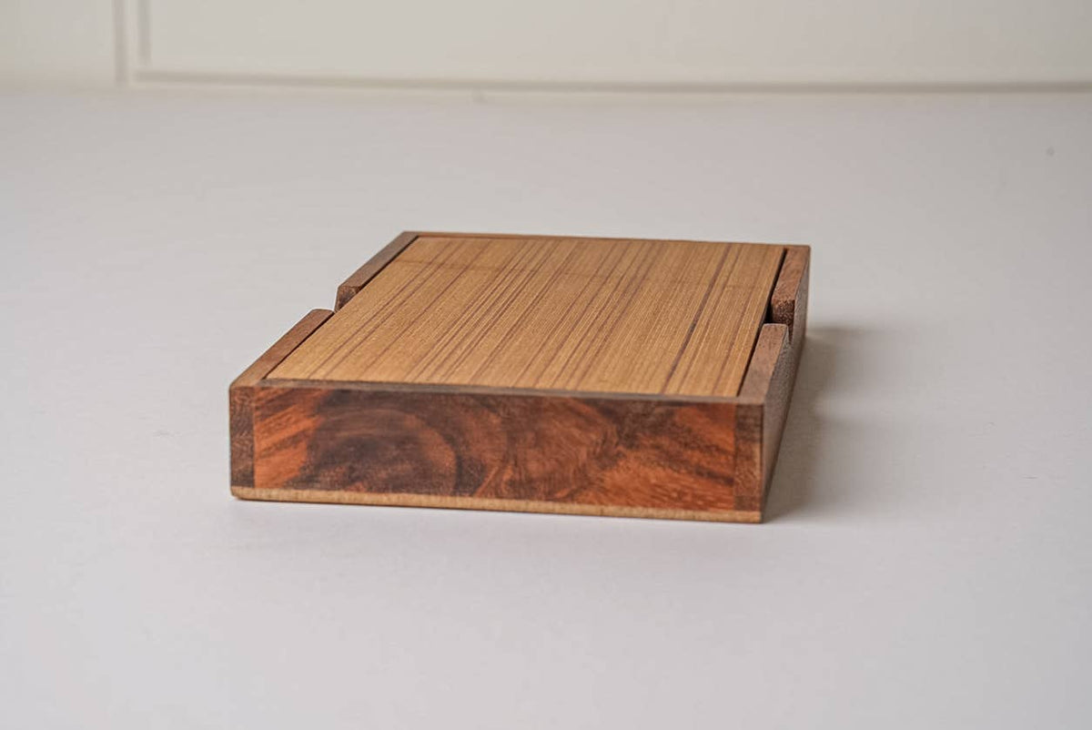 Wooden game with a wood top on a white surface