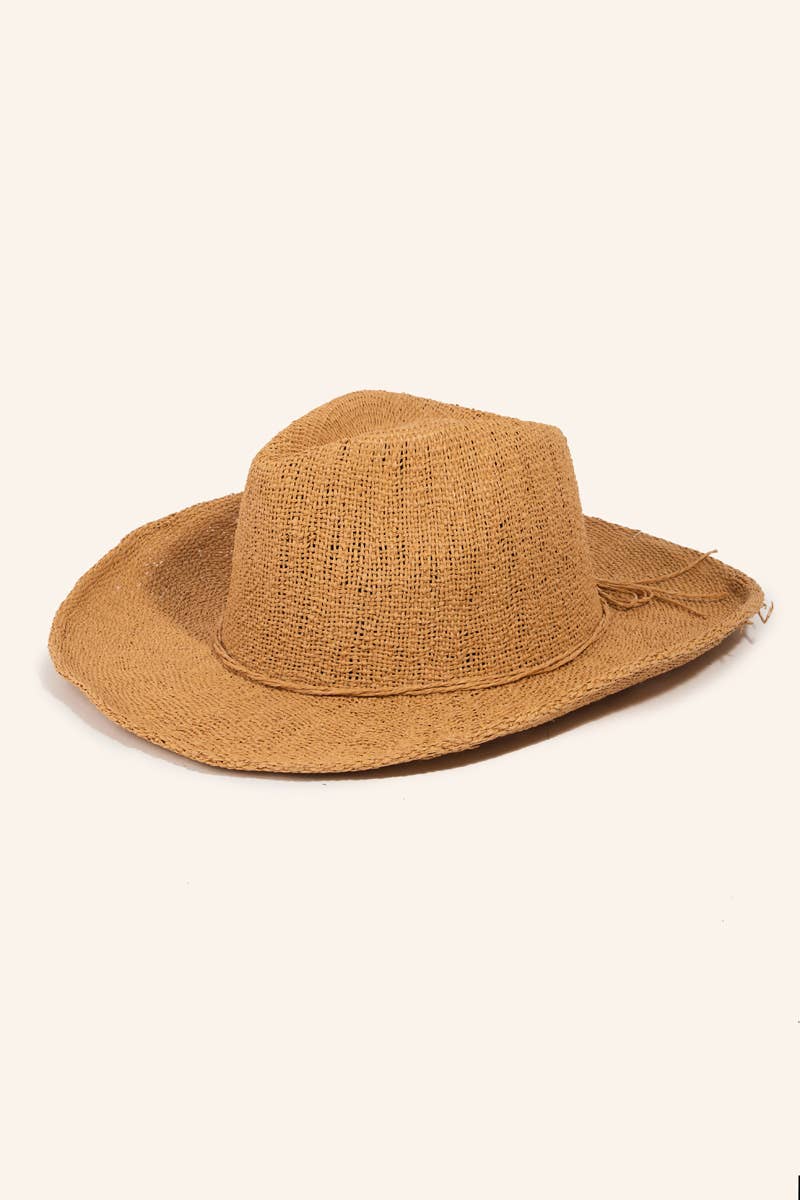 Brown straw hat on a light beige background
