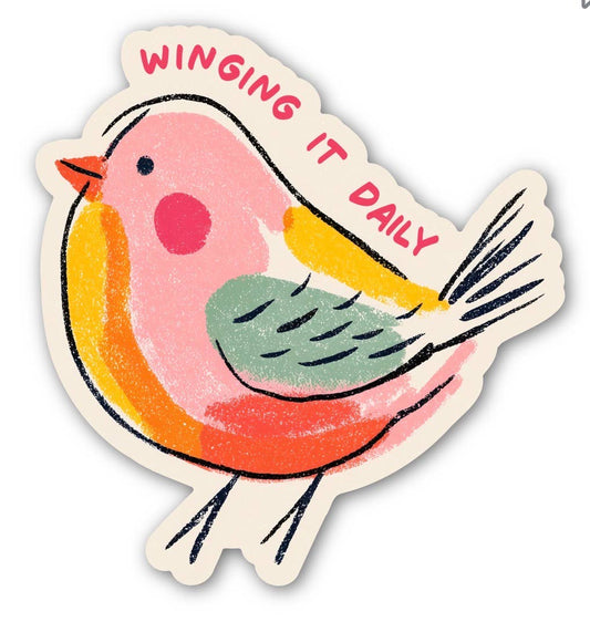 Colorful bird sticker with 'Winging It Daily' text on a white background