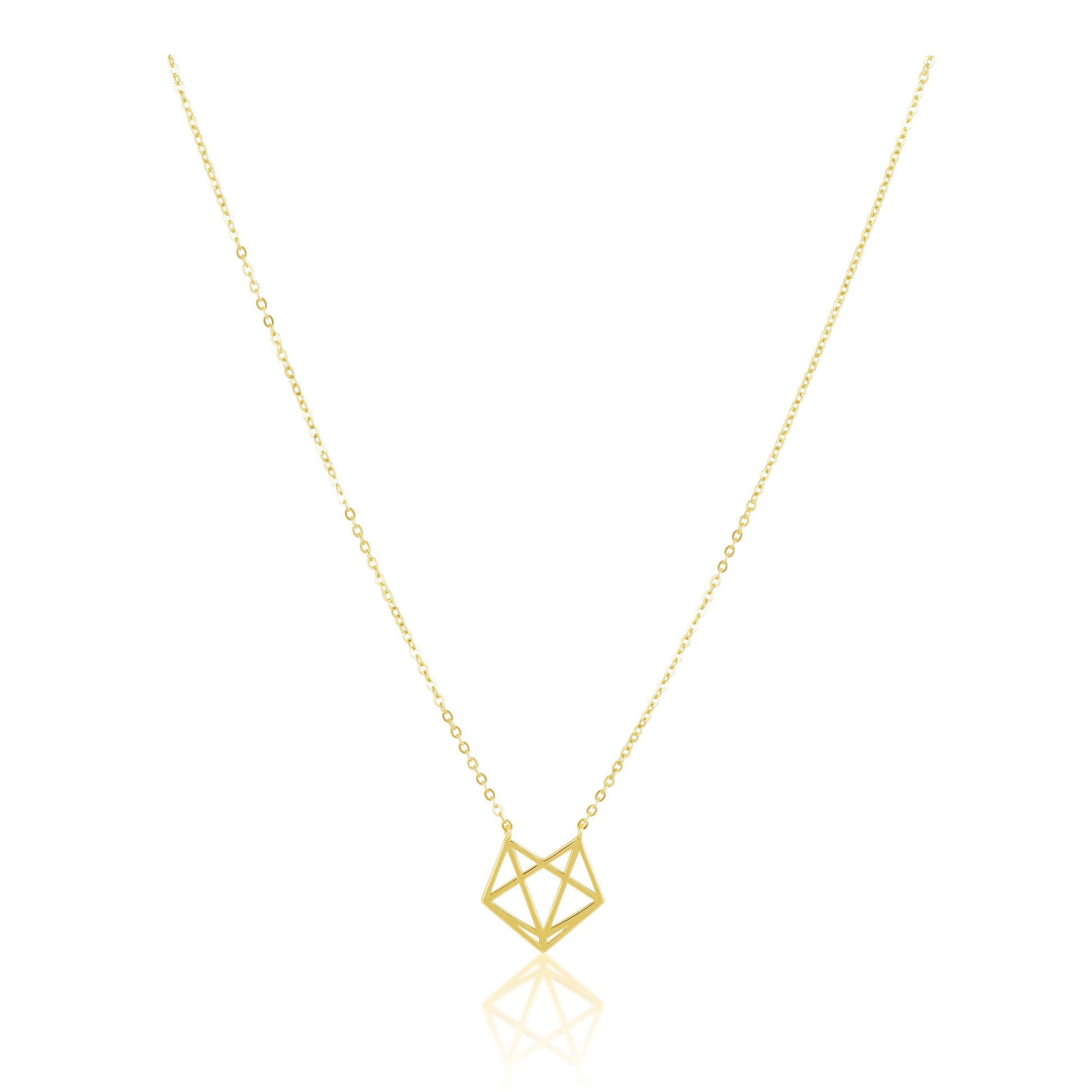 Gold geometric necklace on a white background