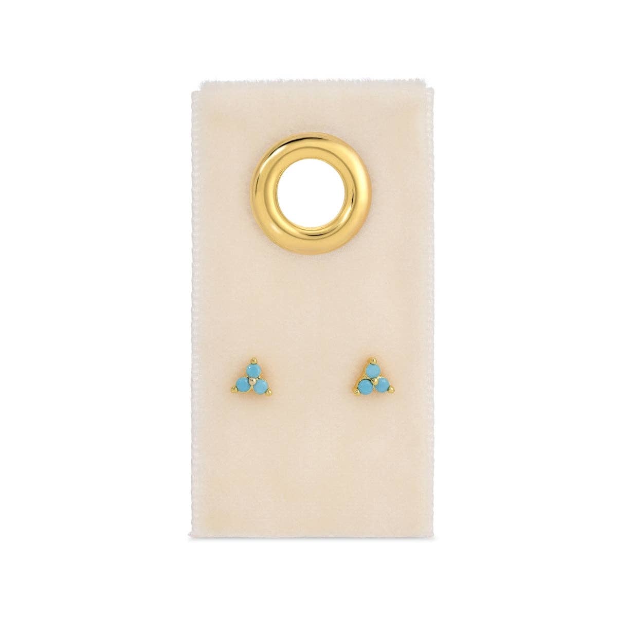 Gold and turquoise earrings on a beige card with a gold ring design.