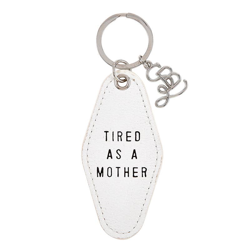 White keychain with 'Tired as a Mother' text on a white background