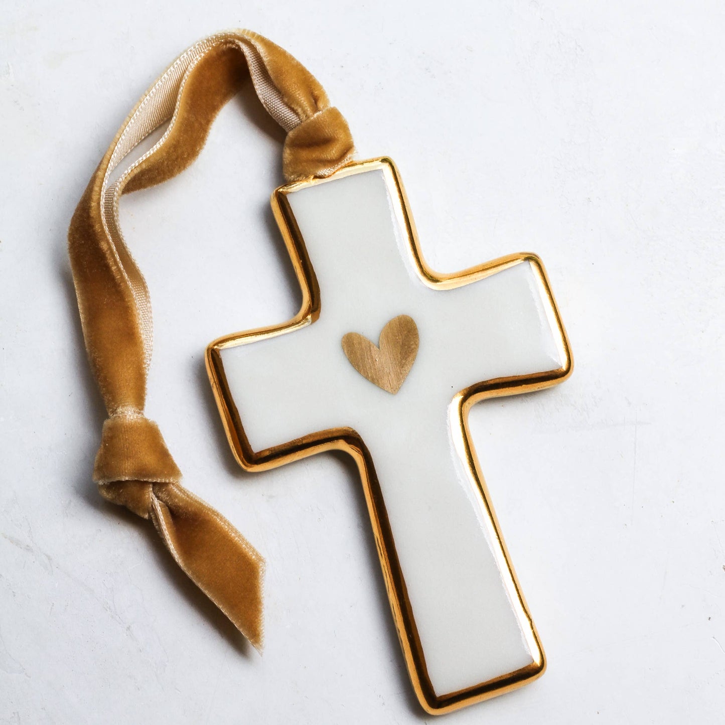 Decorative cross with a heart on a white background
