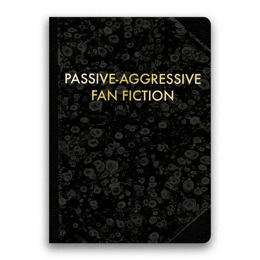 Black notebook with gold text 'Passive-Aggressive Fan Fiction' on a white background