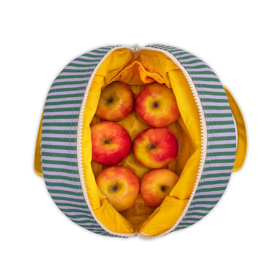 Reusable bag with striped green and yellow pattern filled with apples on a white background