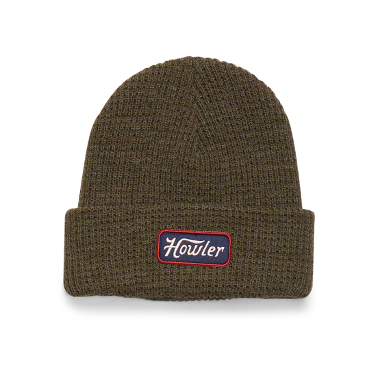 Brown knit beanie with a logo patch on a white background