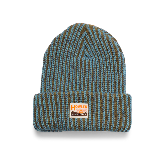 Knitted beanie with a brand label on a white background