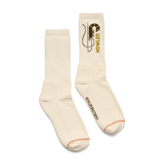 Pair of cream socks with a logo and text on a white background