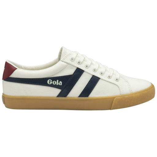 White sneaker with navy stripes and brown sole on a white background