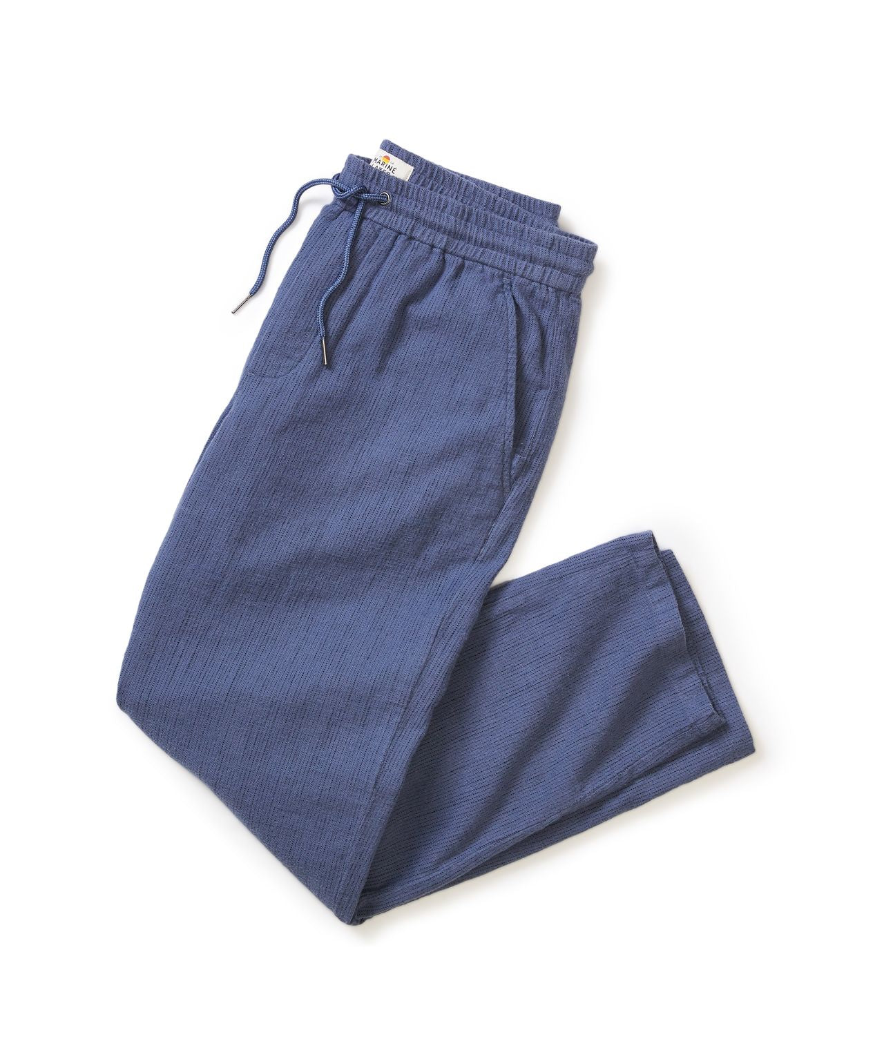 Blue ribbed pants with drawstring on a white background