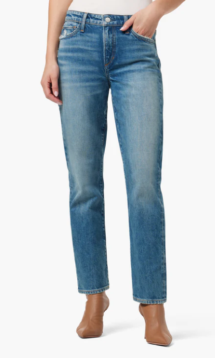 A pair of mid-rise dark-wash cigarette jeans with whiskering and a stone enzyme wash.